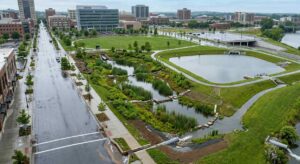Aerial view of urban stormwater management system with retention pond and bioswales